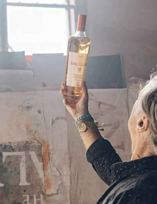 david carson holding the macallan colour collection whisky bottle