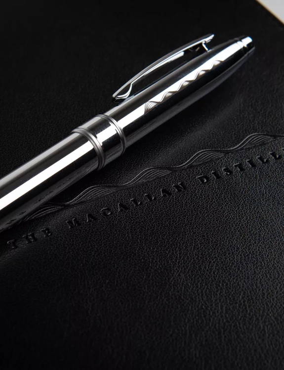 The Macallan Notebook and Pen with Macallan Logo in Black