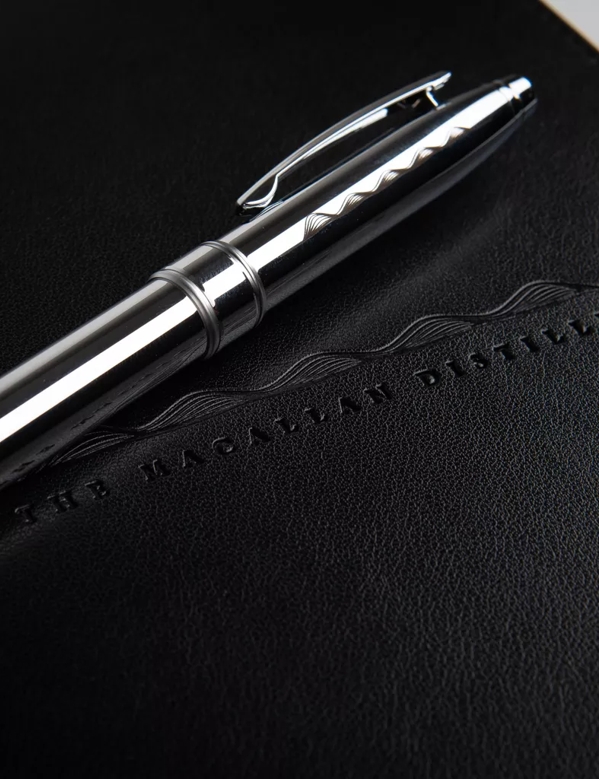 The Macallan Notebook and Pen with Macallan Logo in Black