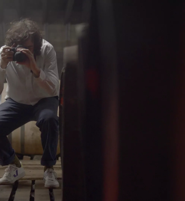 Erik Madigan Heck taking photos of casks