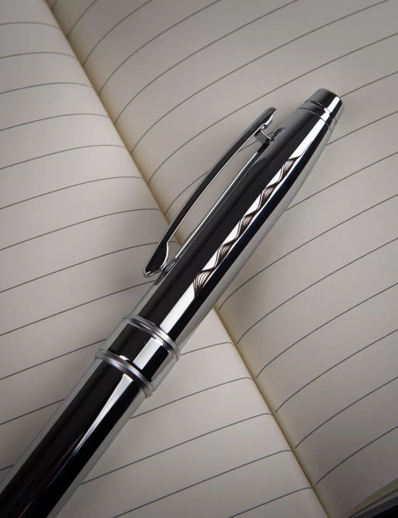 The Macallan Notebook and Pen Close up 