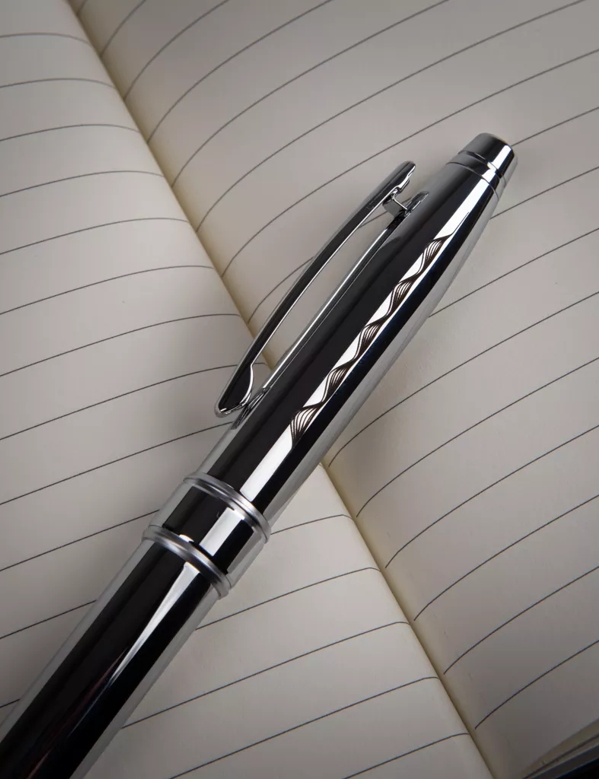 The Macallan Notebook and Pen Close up 
