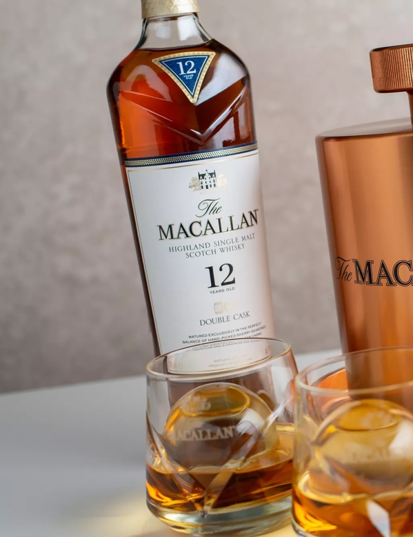 The Macallan Ice Ball Maker Lifestyle Shot with Bottle, 2 glasses angled image
