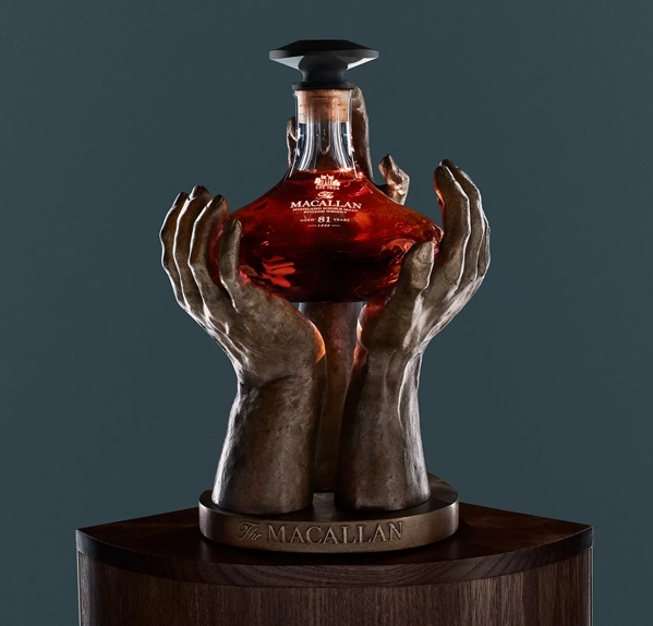 The Macallan The Reach Sculpture and bottle on blue background