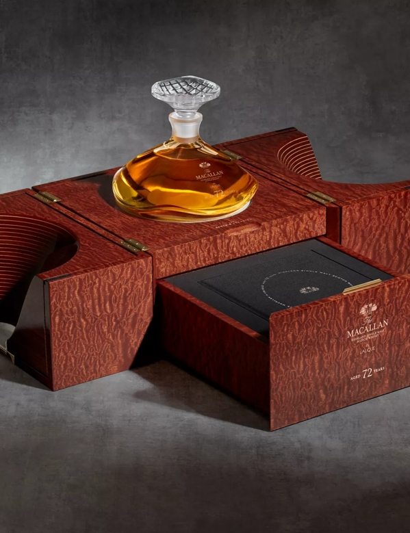 the macallan 72 years old whisky in lalique genesis decanter open box shot from side