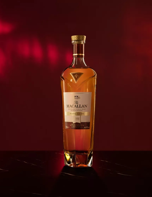 The Macallan 2022 rare cask whisky bottle on red moody background