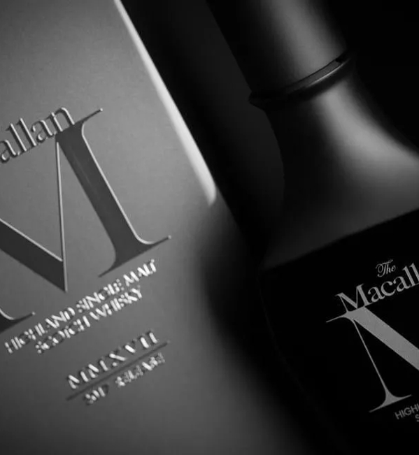 the macallan m black 2019 whisky bottle and pack close up