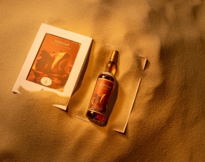 The Macallan Folio 8 bottle and pack in sand