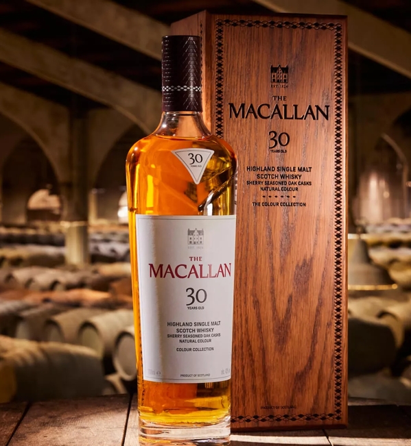 the macallan colour collection 30 year old whisky bottle and box with whisky barrels