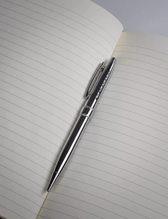The Macallan Notebook and Silver Pen on Ruled Paper