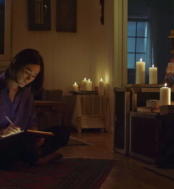 Erica Dorn Drawing in Room with Candles