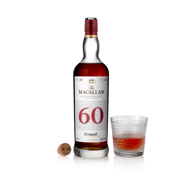 The Macallan 60 year old whisky bottle and half full glass