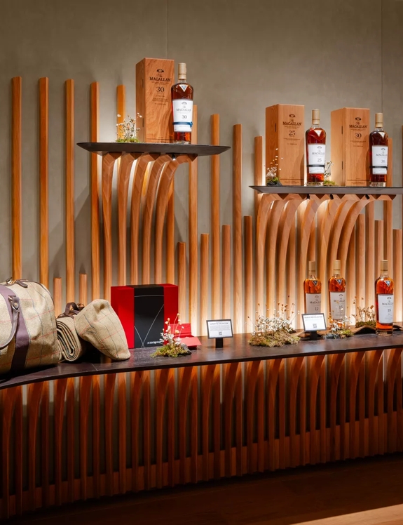 The Macallan House Hong Kong bottles displayed on wall 