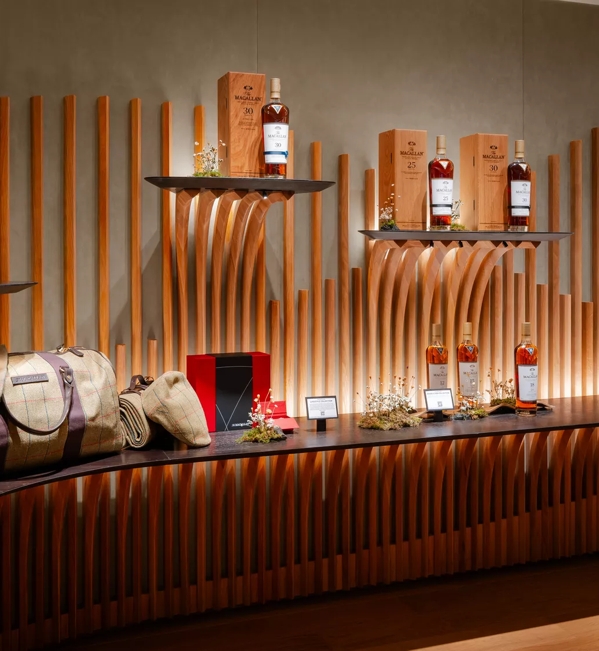 The Macallan House Hong Kong bottles displayed on wall 