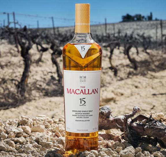 the macallan colour collection whisky bottle on jerez field background
