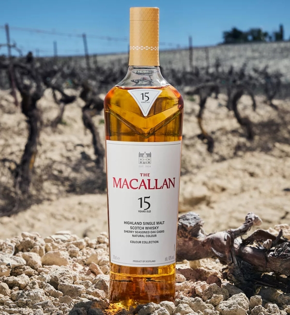 the macallan colour collection whisky bottle on jerez field background