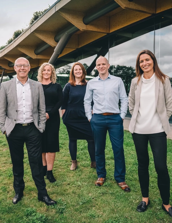 The Macallan whisky mastery team outside the distillery