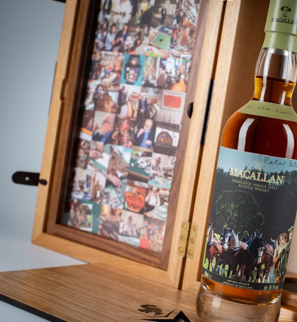 The Macallan Anecdotes of Ages Collection: The Old Farm Bottle out Box with Imagery in Box Mood shot
