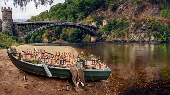 the macallan fine and rare bottles on boat by the river