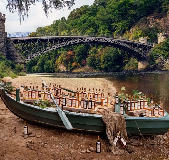 the macallan fine and rare bottles on boat by the river
