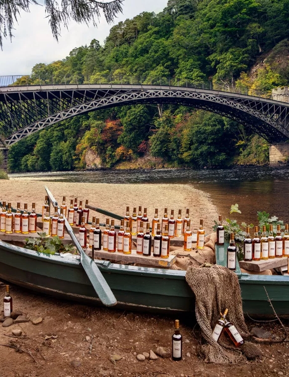 the macallan fine and rare bottles on boat by the river