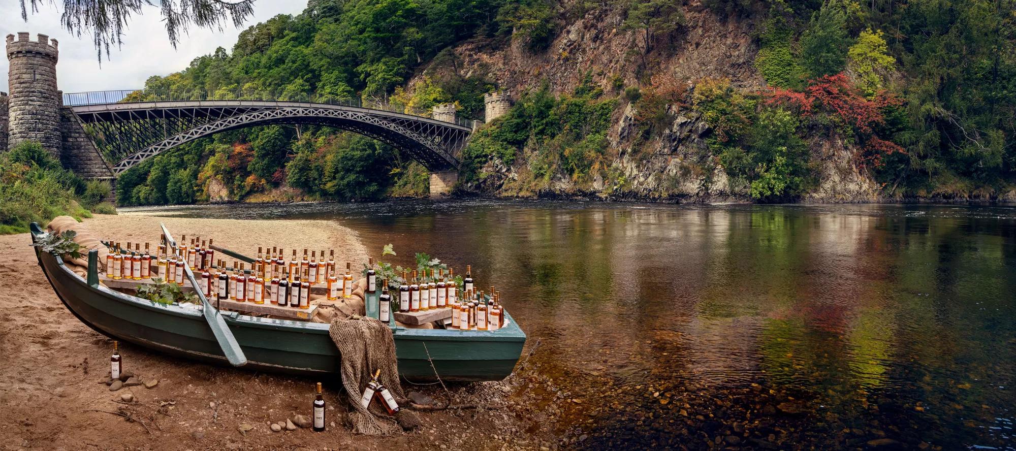 the macallan fine and rare bottles on boat by the river
