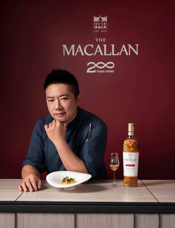 guest at The Macallan Taiwan Event with food and bottle with dram 