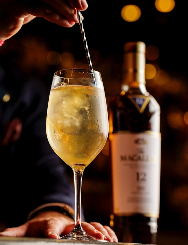 Bottle of Macallan and cocktail at Waldorf Hotel