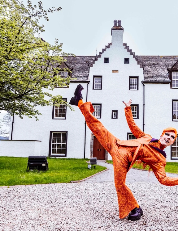 The Macallan Launches Cirque du Soleil at The Macallan Estate Fox Performer in front of Easter Elchies House