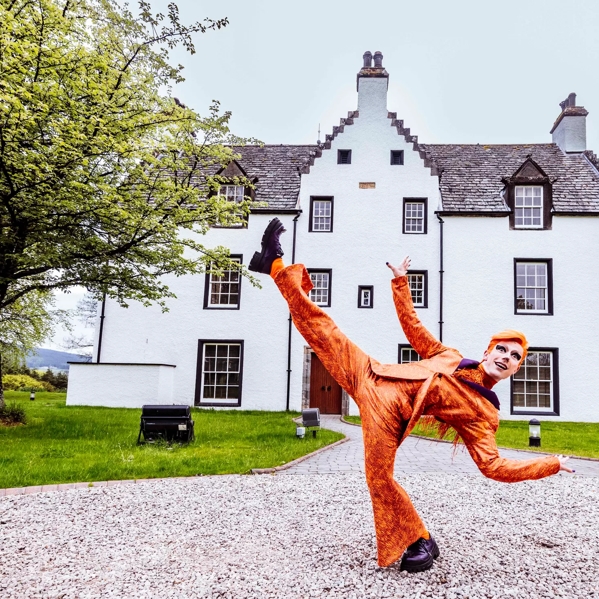 The Macallan Launches Cirque du Soleil at The Macallan Estate Fox Performer in front of Easter Elchies House