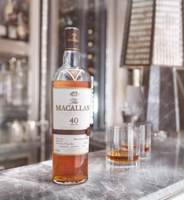 the macallan sherry oak 40 years old 2016 release whisky bottle and glasses on bar