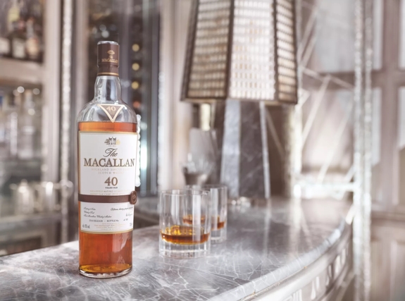 the macallan sherry oak 40 years old 2016 release whisky bottle and glasses on bar