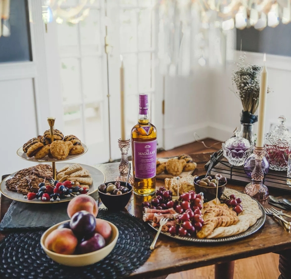 The Macallan Edition No. 5 Lifestyle Shot Bottle on Table with Food