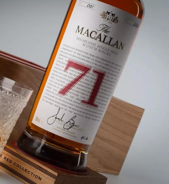 The Macallan Red Collection 71 year old whisky bottle and glass angled shot