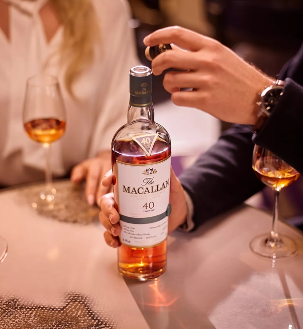 people at table tasting the macallan sherry oak 40 years old 2017 release whisky 