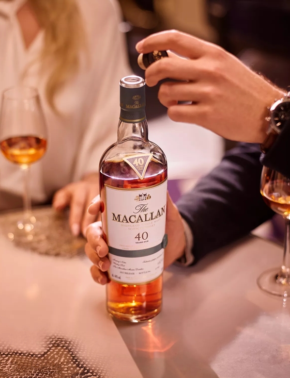 people at table tasting the macallan sherry oak 40 years old 2017 release whisky 