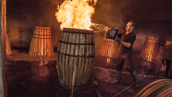 the macallan whisky casks production man with fire