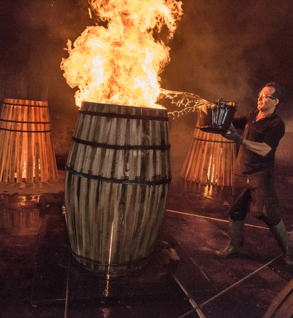 the macallan whisky casks production man with fire