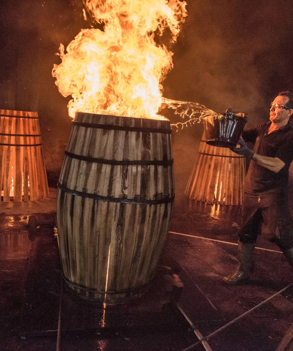 the macallan whisky casks production man with fire