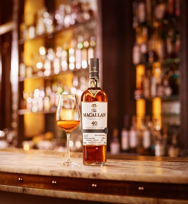 the macallan sherry oak 40 years old 2017 release whisky bottle and glass in bar
