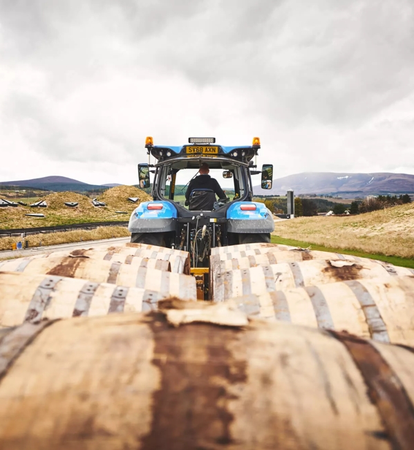 the macallan distillery tractor with whisky barrels