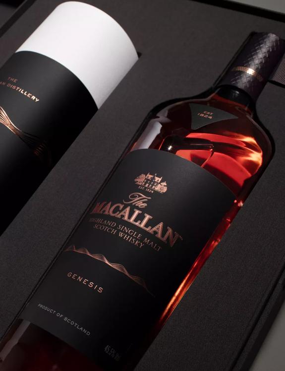 the macallan genesis whisky bottle inside open pack angled