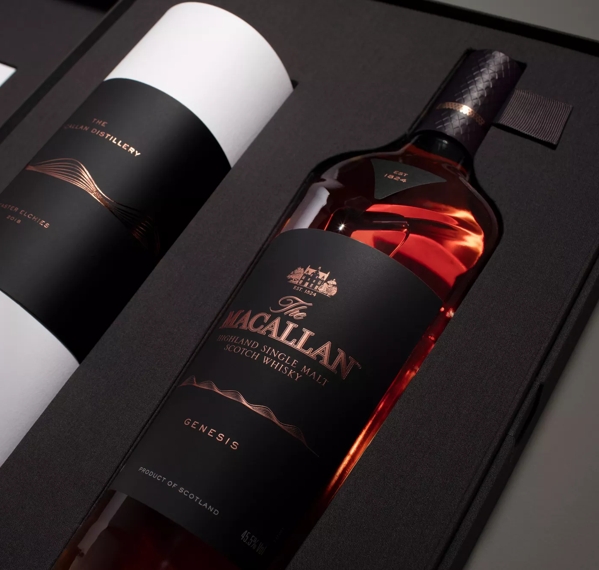 the macallan genesis whisky bottle inside open pack angled