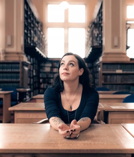 Jenni sitting in the library