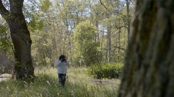 Erik Madigan Heck walking in forest