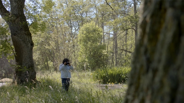 Erik Madigan Heck walking in forest 