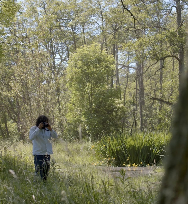 Erik Madigan Heck walking in forest 