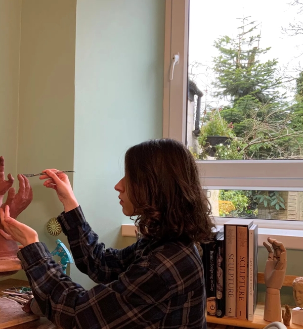 Sasika working on The Reach sculpture