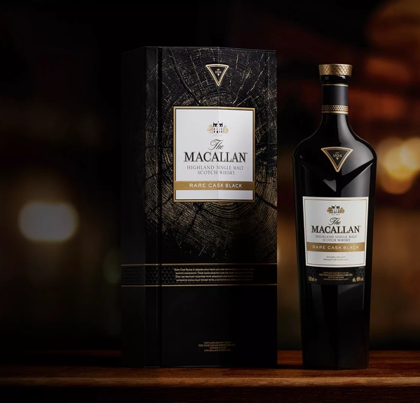 The Macallan Rare Cask Black whisky bottle and closed box on dark moody background