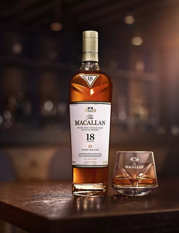 macallan 18 years old sherry oak bottle and glass in bar